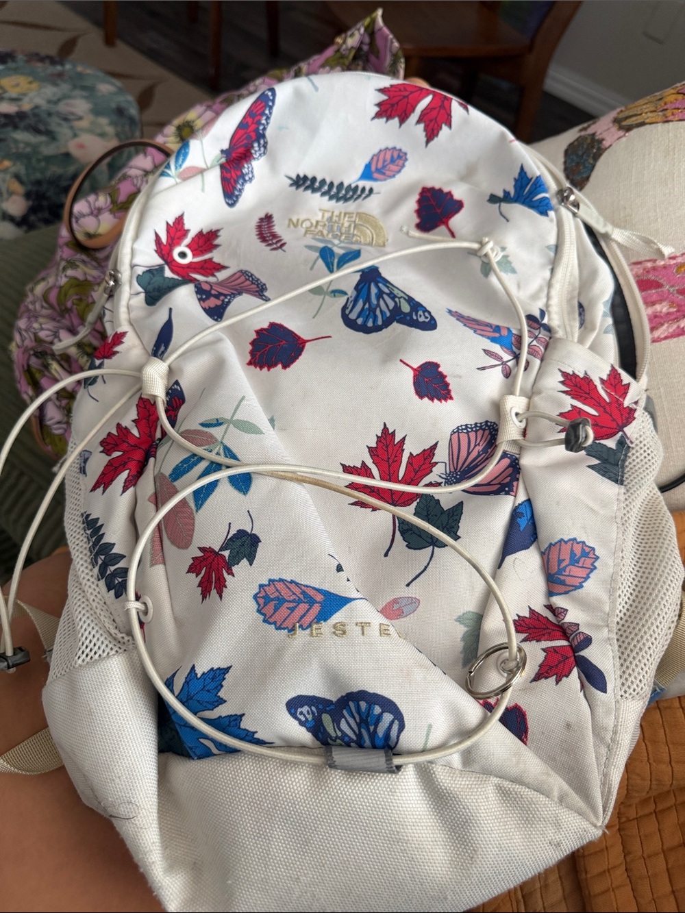 The North Face White Backpack with Red & Blue Floral & Butterfly Print